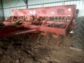 International 511 combine with roller and harrows