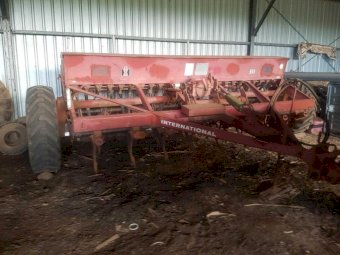 International 511 combine with roller and harrows