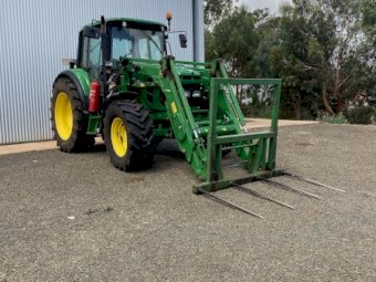 2009 John Deere 6330 with H310 FEL