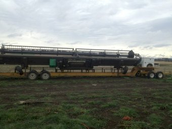 John Deere 9760 Header with 2009 40’ tine reel Midwest front with Coolamon steelworks comb trailer