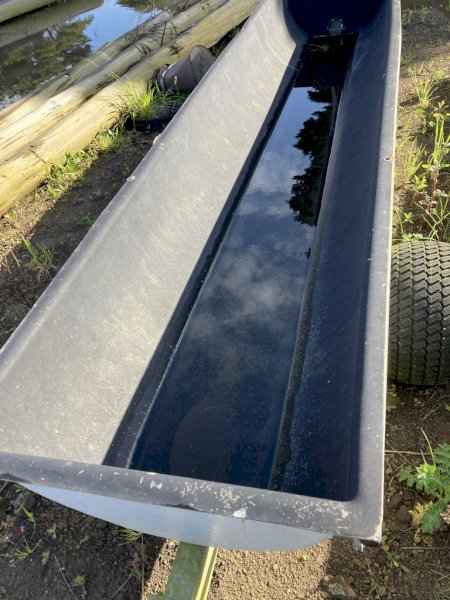 Feed troughs on wheels and with tow bar