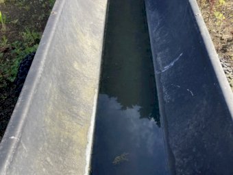 Feed troughs on wheels and with tow bar