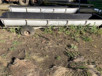 Feed troughs on wheels and with tow bar