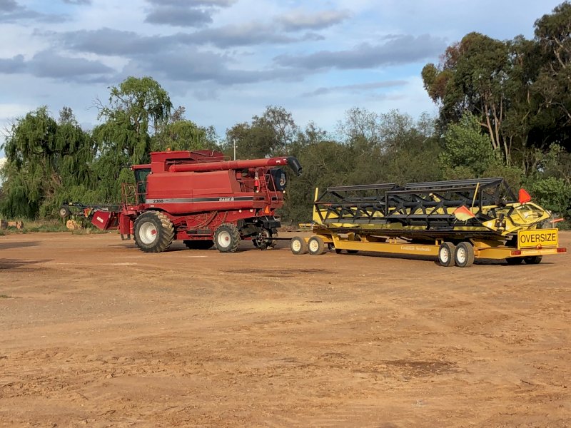 Case IH 2388 Header with 36' Honeybee Front on Trailer