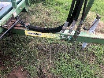 Hustler Hay bale feed out cart