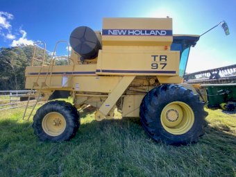 New Holland TR97 Harvester with John Deere 24ft Stainless Front
