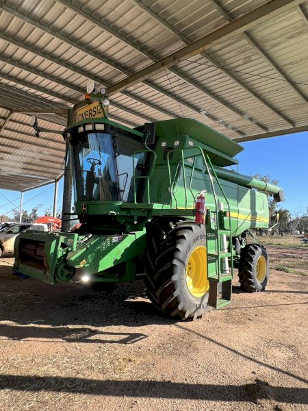 John Deere 9750 STS Header with 936D Draper Front on Trailer
