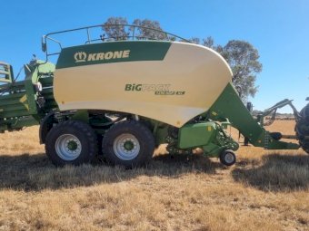 2015 John Deere 8295R Tractor with a 2017 Krone 1290 Big Pack Baler