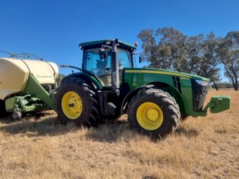 2015 John Deere 8295R Tractor with a 2017 Krone 1290 Big Pack Baler