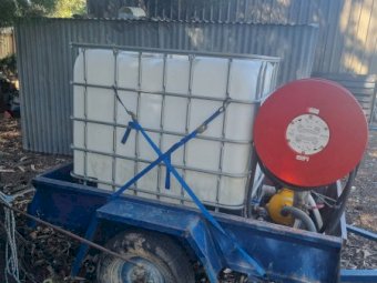 6x5 Box Trailer with Tank and Firefighter