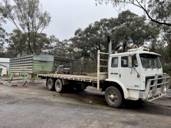 Under Auction - 1994 International Acco  2350 C Truck with 2 deck sheep crate 