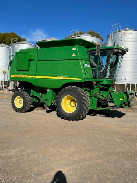 2002 John Deere 9750 STS header with 936D front and trailer.