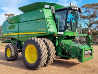 John Deere STS 9670  Bullet Rotor with Mid West 42 Draper front,  Hamilton comb trailer