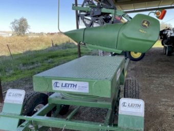2022 John Deere S780 with JD740D Front on Leith Trailer