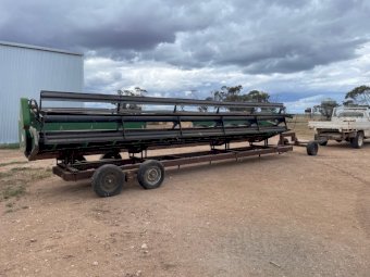 John Deere 925R with Comb Trailer