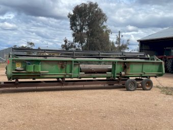 John Deere 925R with Comb Trailer