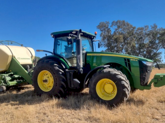 2015 John Deere 8295R Tractor with a 2017 Krone 1290 HDP 11 XC Big Pack Baler
