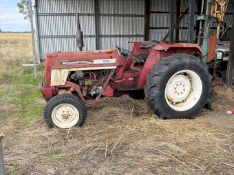 International 454 Tractor with Munro Post Driver
