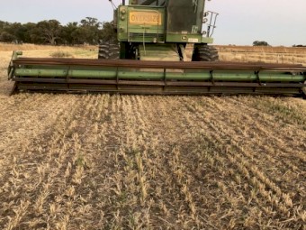 John Deere 7720 Header with  230 30ft front and Canola front