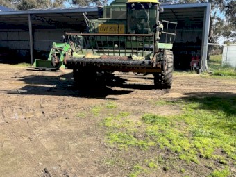 John Deere 7720 Header with  230 30ft front and Canola front