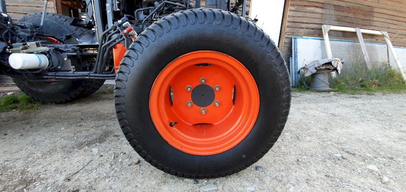 Set of used turf tyres and rims from a Kubota L3540