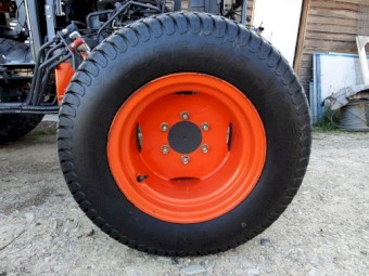 Set of used turf tyres and rims from a Kubota L3540
