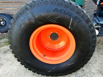 Set of used turf tyres and rims from a Kubota L3540