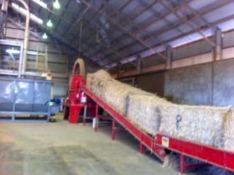 Tub Grinder with large bale conveyor