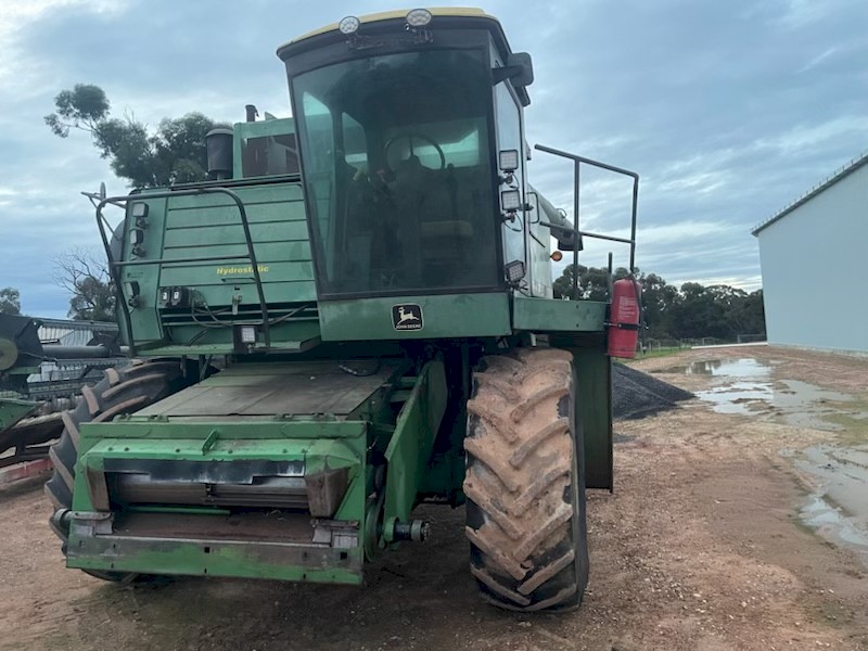 John Deere 7720 Harvester with 24ft finger tyne reel front on Leith trailer plus spare 7720 and two fronts for parts