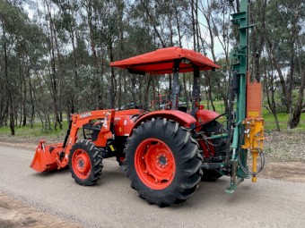 Kubota M7040 Tractor & Post Hole Driver
