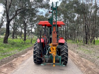 Kubota M7040 Tractor & Post Hole Driver