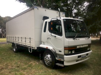1999 Mitsubishi FK618 Curtain Sider Rigid with Tail Gate. PRICE IS NEGOTIABLE