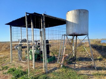 John Deere engine, pump, Generator, shed, fuel tank and all above ground plumbing.