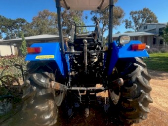 2012 New Holland TT75 with FWA and Challenge Front Loader