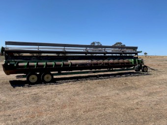 John Deere 8820 Hydrostatic Header. 34ft comb on trailer.