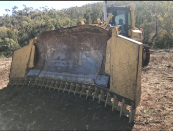 2006 Komatsu D65ex-15eo and Gessner Stick Rake.