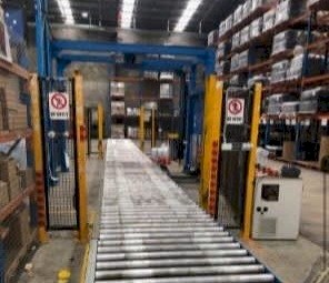Automatic Pallet Wrapper Incl. Roller Conveyor Safety Barrier