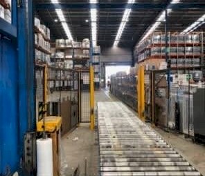 Automatic Pallet Wrapper Incl. Roller Conveyor Safety Barrier