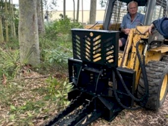 TREE PULLER SKID STEER ATTACHMENT.