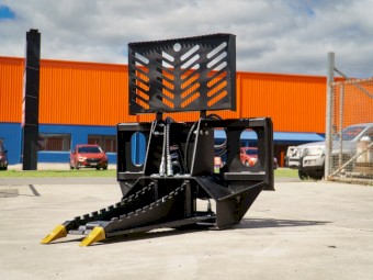 TREE PULLER SKID STEER ATTACHMENT.