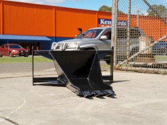 SKID STEER STUMP BUCKET TREE REMOVER.