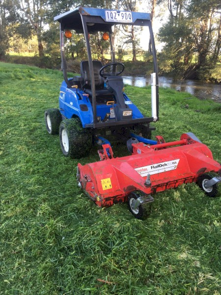2012 New Holland G6030 and Trimax Flail Deck Mulcher