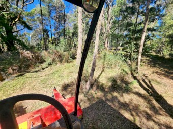 2012 New Holland G6030 and Trimax Flail Deck Mulcher