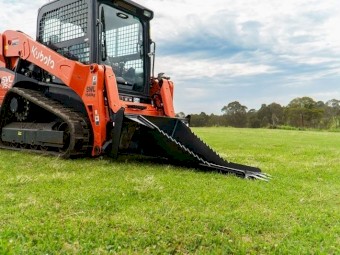 SKID STEER STUMP BUCKET TREE REMOVER.