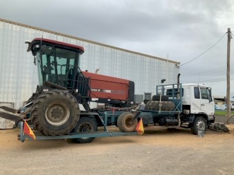 Case WDX 1701 Windrower with UD Transport Truck