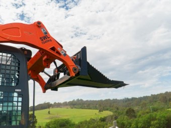 SKID STEER STUMP BUCKET TREE REMOVER.