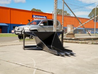 SKID STEER STUMP BUCKET TREE REMOVER.