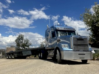2013 Freightliner Coronado 122 with 1997 Freighter Flattop Trailer