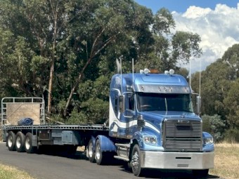 2013 Freightliner Coronado 122 with 1997 Freighter Flattop Trailer