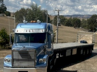 2013 Freightliner Coronado 122 with 1997 Freighter Flattop Trailer
